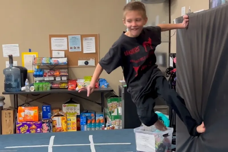 A child on the ninja obstacle course at Apex Gymnastics