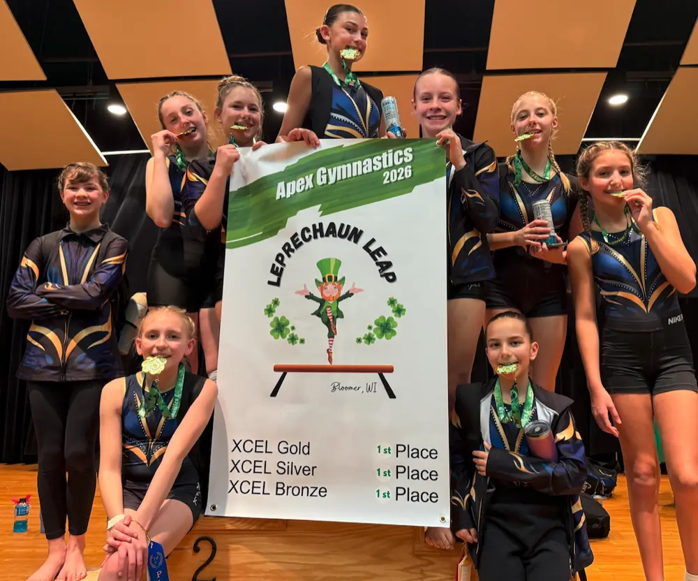 Apex gymnasts on the podium at a competition